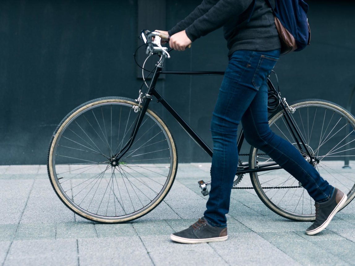 person with bike near 50 Jones Apartments